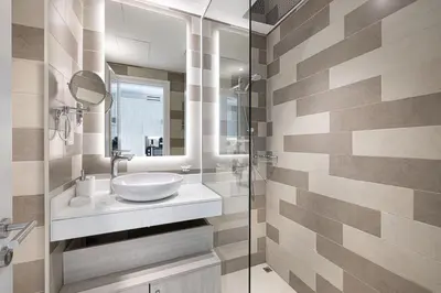 a bathroom with a sink and a mirror at Seven Palm Apartment with Private Beach Access and Infinity Pool in Dubai