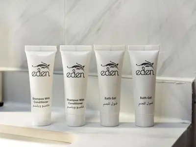 a group of four tubes of cream on a shelf at Luxurious Home in the heart of Dubai Marina in Dubai