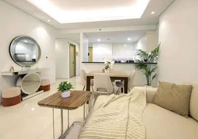 a living room with a couch and a table at The Perfect Stay Paramount Business Bay 2BR in Dubai
