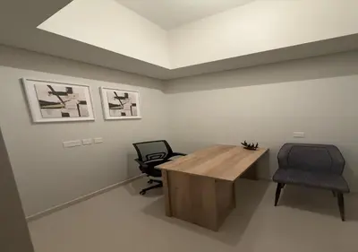 a office with a wooden desk and a chair at Aykon city 2BHK beach city view in Dubai