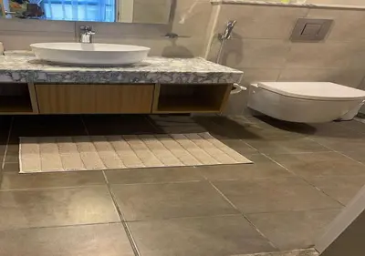 a bathroom with a sink and a toilet at Aykon city 2BHK beach city view in Dubai