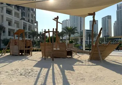 a playground in the sand in a city at Elegant 1 Bedroom in Orchid at Creek Beach in Dubai