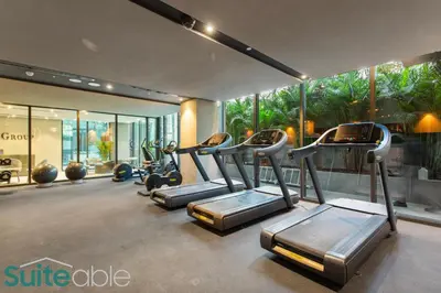 a gym with cardio equipment in a building at Urban Retreat Studio in The Autograph JVC in Dubai
