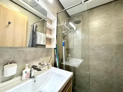 a bathroom with a sink and a shower at Homes2Retreat - Stylish Studio Gym & Pool, JVC Dubai in Dubai
