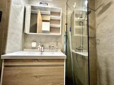 a bathroom with a sink and a shower at Homes2Retreat - Stylish Studio Gym & Pool, JVC Dubai in Dubai
