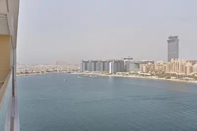 a view of a large body of water with buildings at Beach View 1BR at Beachfront 50 Off Eid Offer in Dubai