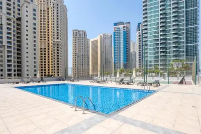 a swimming pool in a city with tall buildings at Stunning Views Spacious 3BR Dubai Marina in Dubai