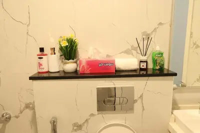 a bathroom with a counter with toiletries on it at Luxurious Studio Apartment in Dubai