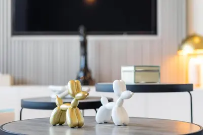 a figurine of mice sitting on a table at Burj Alarab & Atlantis Palm Sea view, Beachfront, peaceful 3 Bedroom Apartment TIARA Residence with Pool, fast Wifi in Dubai