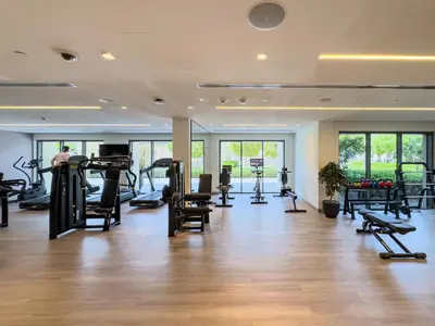 a gym with treadmills and exercise equipment in a building at Burj Royale 1 BR 5 Min Walk to Burj Khalifa in Dubai