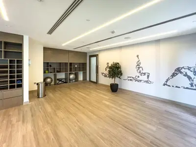 an empty room with a potted plant in the middle at Burj Royale 1 BR 5 Min Walk to Burj Khalifa in Dubai