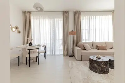 a living room with a couch and a table at Luxury One-Bedroom Burj Khalifa in Dubai