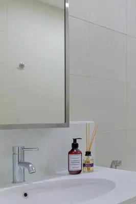 a bathroom sink with a bottle of soap on it at Luxury One-Bedroom Burj Khalifa in Dubai