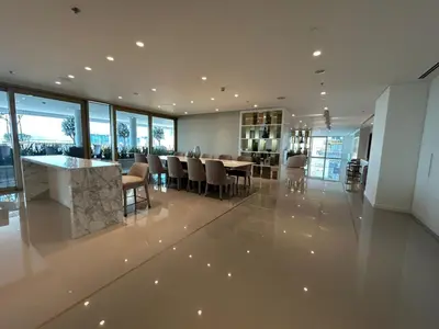 a dining room with a table and chairs at Sea-facing 1BR at Beachfront 50 Off Eid Promo in Dubai