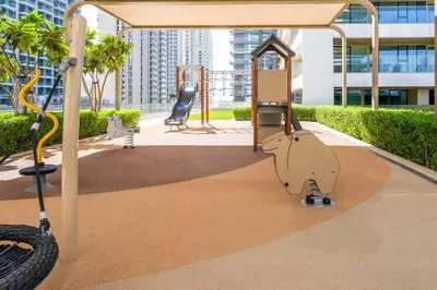 a monkey on a playground in a city at Sea-facing 1BR at Beachfront 50 Off Eid Promo in Dubai