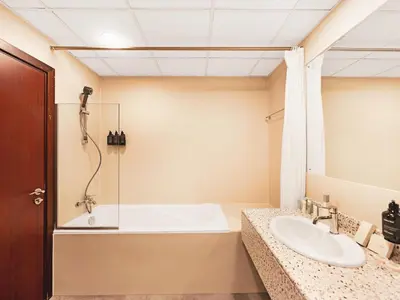 a bathroom with a tub and a sink at New! JBR Beachfront with Panoramic Dubai Eye Views in Dubai