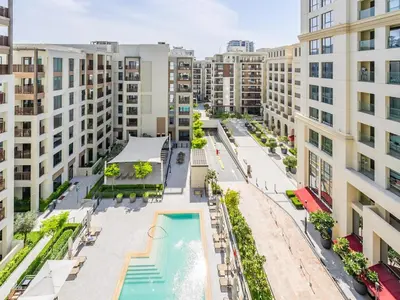an overhead view of an apartment complex with a pool and buildings at Enjoy Sunset at Creek Beach in Dubai