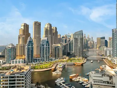 a view of a city with a river and buildings at Luxurious 2BR Apt with Marina View & Private Jacuzzi in Dubai