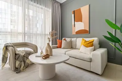 a living room with a couch and a table at Silkhaus Dubai Marina 1BR in Bay Central West Tower in Dubai