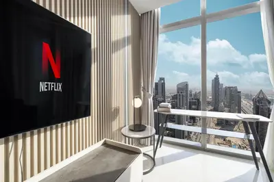 a living room with a view of the city at Sky Suite 1 Bedroom Apartment with Infinity Rooftop Pool and Dubais Ultimate Skyline View at Paramount Midtown in Dubai