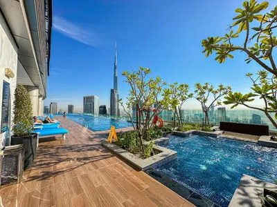 a swimming pool on the top of a building at Sky Suite 1 Bedroom Apartment with Infinity Rooftop Pool and Dubais Ultimate Skyline View at Paramount Midtown in Dubai