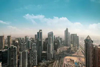 an aerial view of a city with tall buildings at Sky Suite 1 Bedroom Apartment with Infinity Rooftop Pool and Dubais Ultimate Skyline View at Paramount Midtown in Dubai