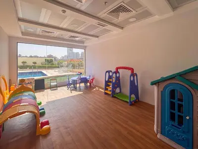 a room with play equipment and a large window at Frank Porter - Rokane G22 in Dubai