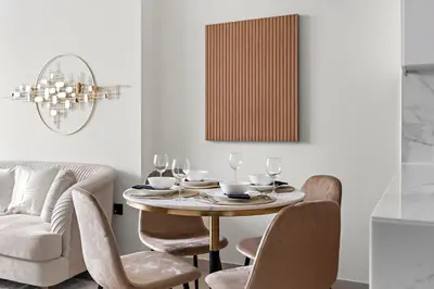 a dining room with a table and chairs at FIRST CLASS 1BR Cozy Urban Getaway in Dubai