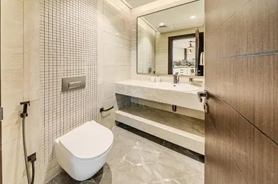 a bathroom with a toilet and a sink at Spacious & Elegant 1BD, for 2 in Nobles tower in Dubai