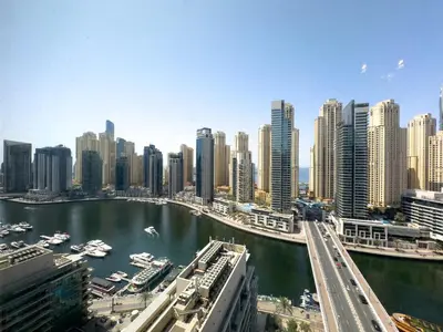 a view of a city with a river and buildings at Serene 2BR Escape - Al Majara - Waterfront Stay in Dubai