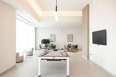 a living room with a ping pong table at FORTE Tower 2 - One-Bedroom Apartment in DOWNTOWN Dubai, near Burj Khalifa & Dubai Fountains - Apartment in Forte Tower 2 in Dubai