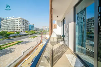 a balcony with a view of a city street at Blue Breeze - Chic & Cozy 1 BR Getaway in Al Furjan in Dubai