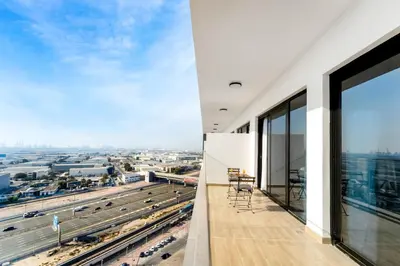 a balcony with a view of a city at Chic 1 BR with Port Views in Dubai