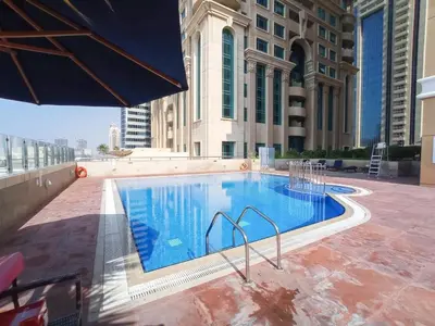 a large swimming pool on top of a building at Stylish1BHK in Elite Residences, Marina with View in Dubai