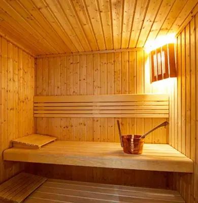 a wooden sauna with a wooden bench in it at GuestReady - Upscale living near Downtown Dubai in Dubai