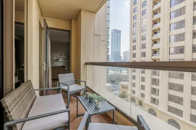 a balcony with two chairs and a table on a building at GuestReady - Contemporary Apt in JBR in Dubai