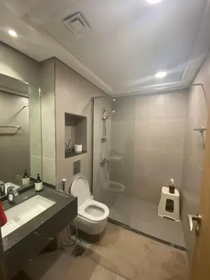 a bathroom with a toilet and a shower and a sink at 2Bedroom Apartment for Rent Fully Furnished ,Spacious in Dubai