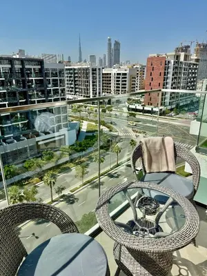 a balcony with chairs and a view of a city at Burj Khalifa View studio in Dubai