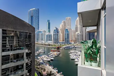 a view of a river with boats in a city at Great Apartments at Marina Star with City View in Dubai