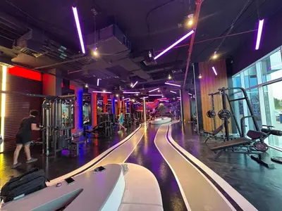 a gym with a bowling lane and people in it at Cozy Studio Apartment Holiday Home l Perfect for Couples in Dubai