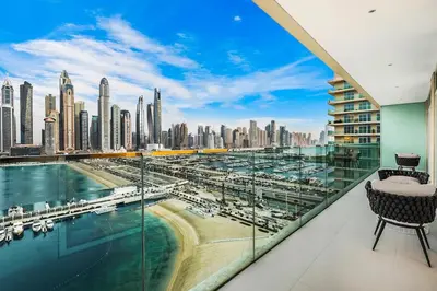 a balcony with a view of a city at Sea View 2BR Near Beach Marina Walk & Dining Spots in Dubai