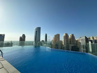 a large swimming pool on the roof of a building at Entire apartment in Dubai Marina in Dubai