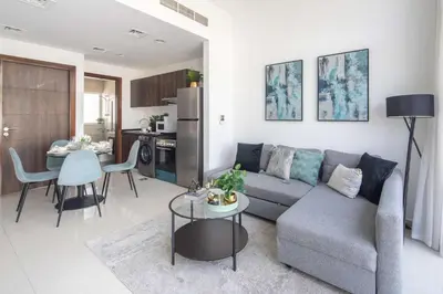 a living room with a couch and a table at Frank Porter - Avencia 44 in ‘Ūd al Bayḑāʼ
