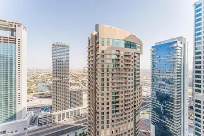 a view of a city with tall buildings at High-Rise 1BR with Lake and City Views and Minutes to Metro, MBL Royal, Jumeirah Lake Towers by Deluxe Holiday Homes in Dubai