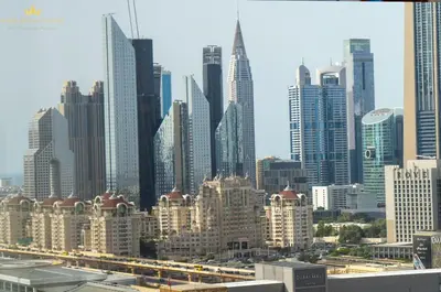 a view of a large city with tall buildings at Dunya Tower Royal suites in Dubai