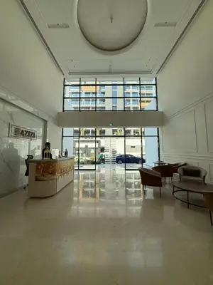 a lobby with a reception desk in a building at Azizi Riviera 43 in Dubai