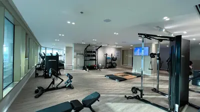 a gym with exercise equipment in a building at Fendi 1BR with Panoramic Sea View in Dubai