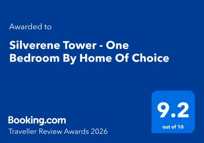 a blue sign with the words silverine tower one bedroom by home of choice at Silverene Tower - One Bedroom By Home Of Choice in Dubai