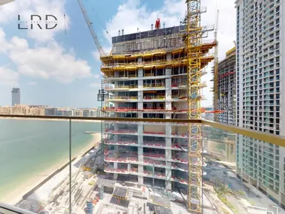 a rendering of the lido building under construction at Waterfront 1 Bedroom Apartment - Private Beach - Emaar Beachfront in Dubai