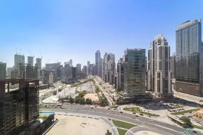 a view of a large city with a highway at Silkhaus Serene 1BR at Boulevard Heights in Downtown in Dubai